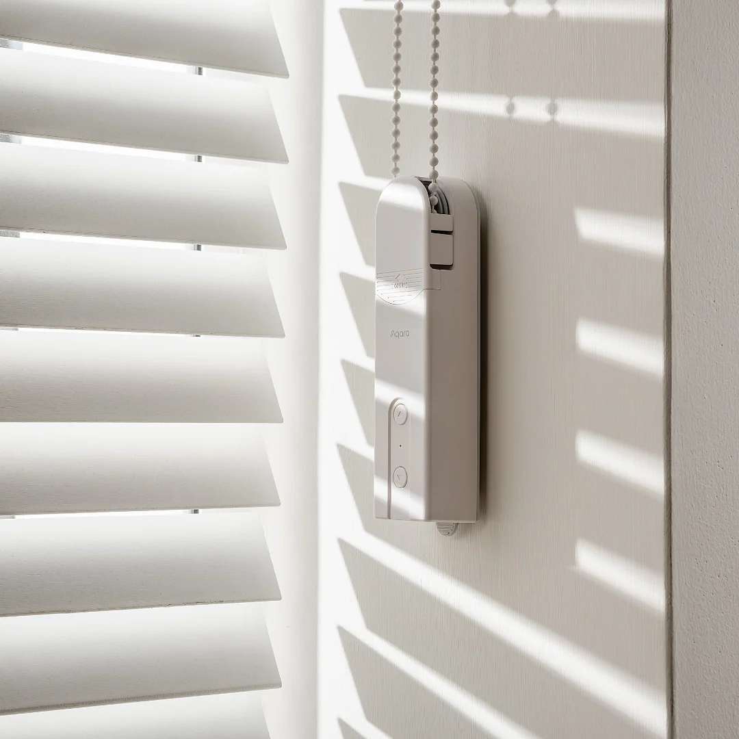 Smart motorised roller blinds on a large window